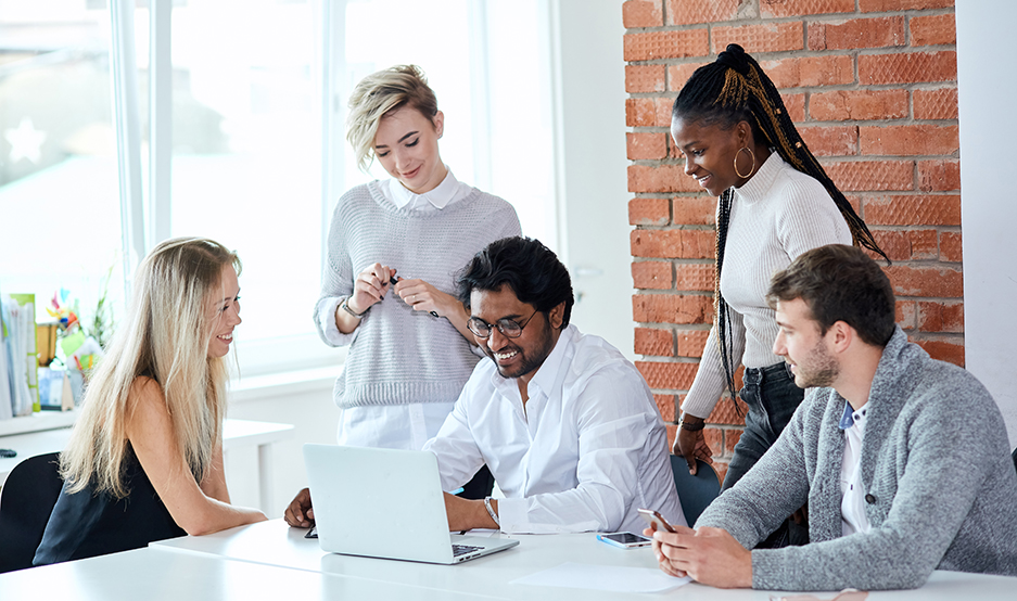 kind boss with his co-workers at work in the loft building. close up photo. managers like their job